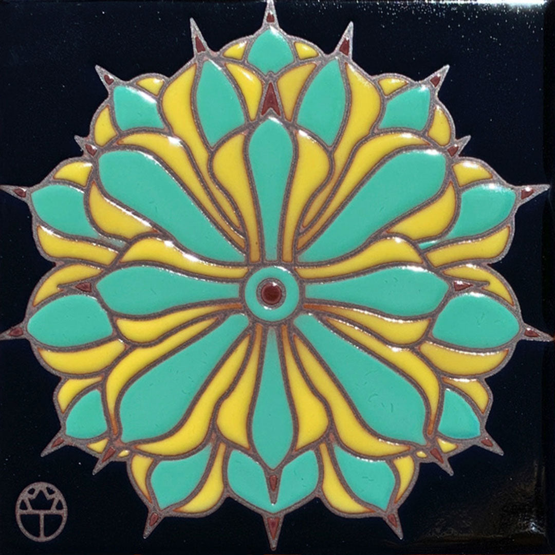 ceramic tile of an agave blossom on a black background
